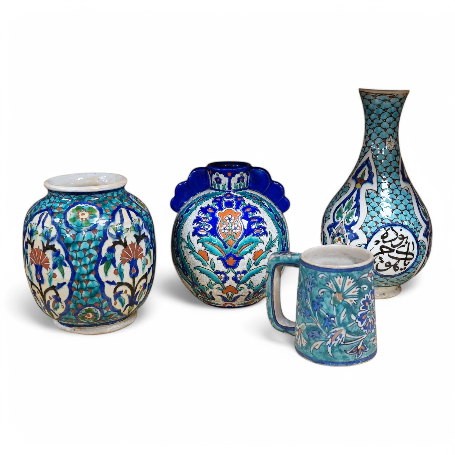 Two Persian vases and a mug, decorated with stylised flowers together with a Laroche Belgium Persian style vase, tallest 28.5cm. Condition - fair to good
